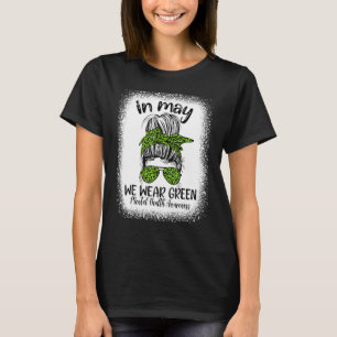 Im Mai tragen wir ein grünes Mental Health Awarene T-Shirt