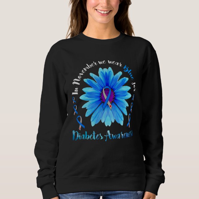 Im November tragen wir das blaue Blume Ribbon Diab Sweatshirt (Vorderseite)