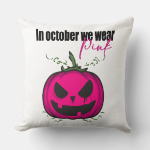 Im Oktober tragen wir Pink mit Jack-O-Lattern Kissen