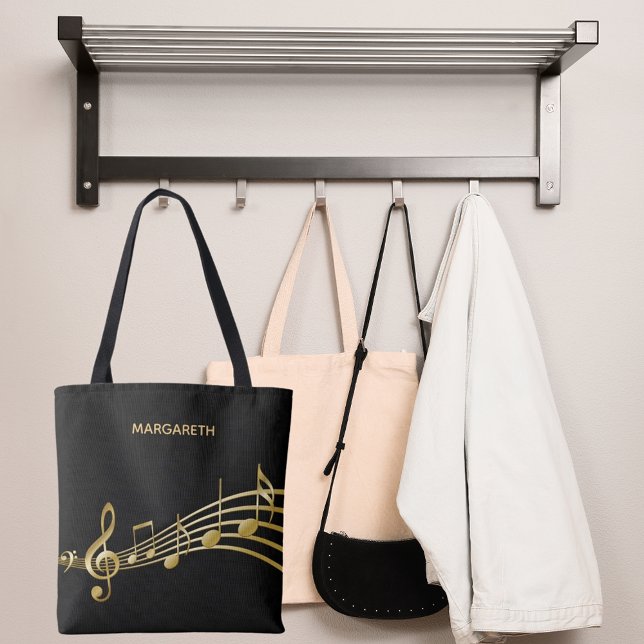 Imitate goldene Musiknoten auf einem schicken schw Tasche (Von Creator hochgeladen)
