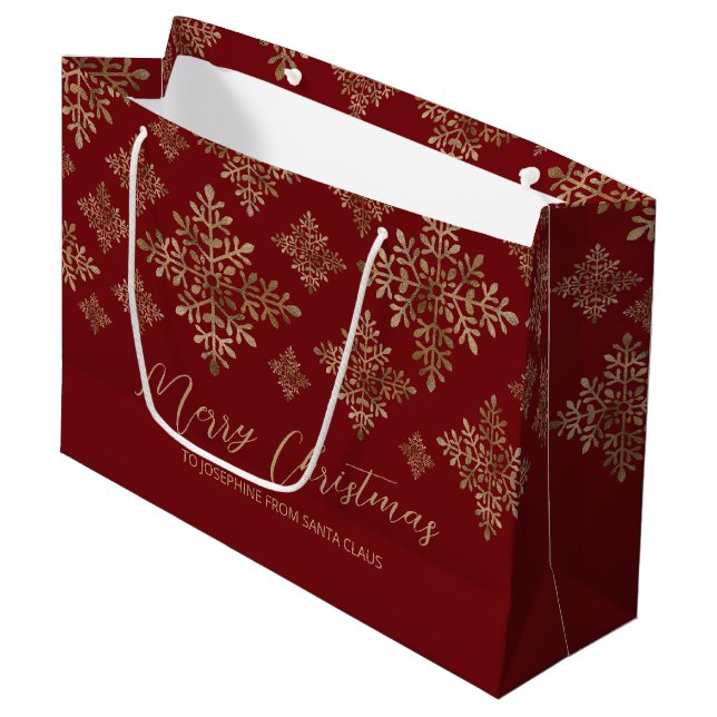 Imitate Schneeflocken auf Rot (nicht echter Boden) Große Geschenktüte (Vorderseite Schrägansicht)