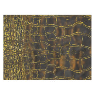 Imitatgoldschlangenhautbeschaffenheit auf dunklem tischdecke