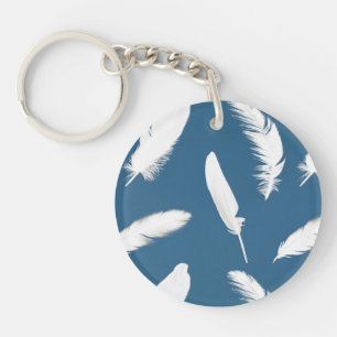 Impression en plumes blanches sur bleu denim