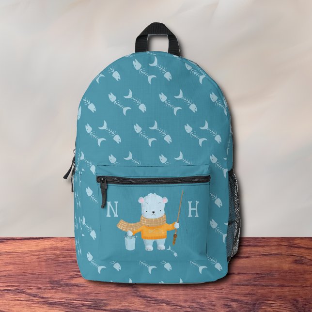 Imprimé Sac à dos bleu pour l'ours polaire de pêche (Adorable kid blue backpack with a polar back holding a fishing rod .
)