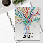 individuelle Name 2023 Planer<br><div class="desc">Dieser einzigartige Planner ist mit einem bunten Baum geschmückt. Das ursprüngliche Design wurde aus Mosaik mit winzigen Glasstücken gemacht. Passen Sie es mit Ihrem Namen und Jahr an. Verwenden Sie zum Bearbeiten das Entwurfstool, um den Schriftart, die Größe des Schriftartes oder die Farbe zu ändern. Weil wir unsere Kunstwerke erstellen,...</div>