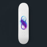 Infinity with Purple Feather Skateboard<br><div class="desc">Infinity symbol with a beautiful feather painted in purple and blue bright colors on white background.</div>