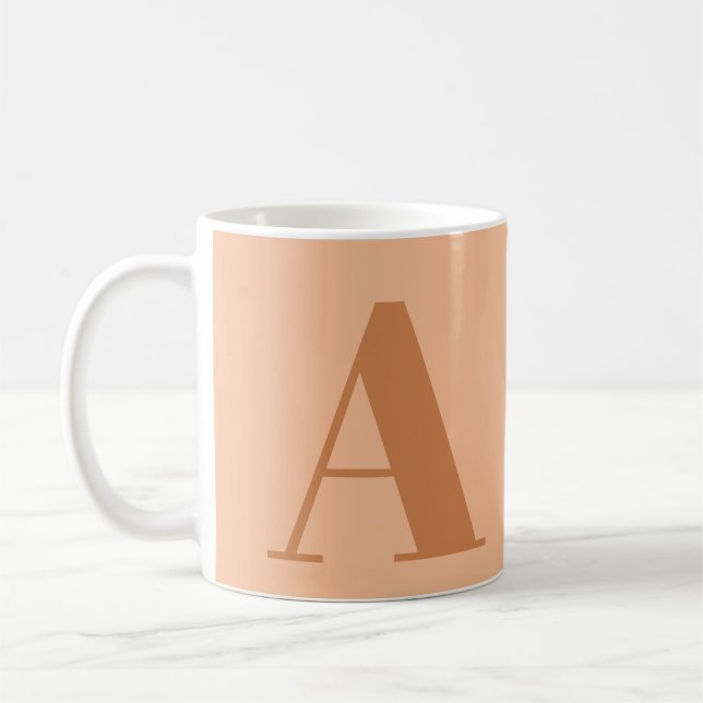 Initialbrief der Peach Monogram Kaffeetasse (Links)
