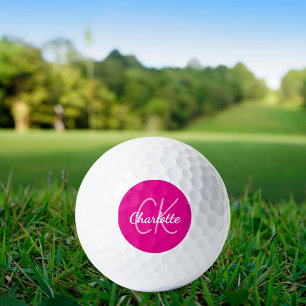 Initialen des Monogrammes mit heißen rosa Namen Golfball