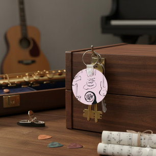 Instruments de musique sur porte-clés rose