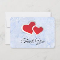 2 Coeurs en papier rouge sur Merci en marbre bleu 