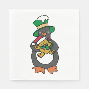 Irischer Pinguin hält Weihnachts-Teddybär Serviette
