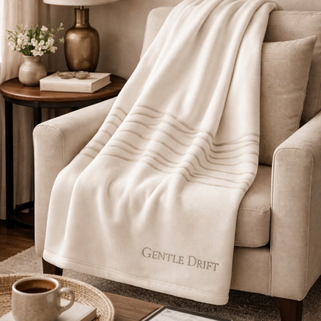Ivory Taupe Drift Fleece Blanket (Soft taupe lines drift across ivory, grounding neutral spaces with gentle visual flow.)
