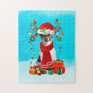 Jack Russell im Schnee mit Weihnachtsgeschenken
