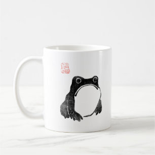 Japanischer mürrischer Frosch Kröte unbeeindruckte Kaffeetasse