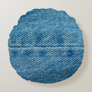 Jeans Nahaufnahme Hintergrund. Denim-Nähte. Blaues Rundes Kissen