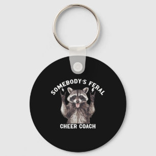 Jemandes Wilder Cheer Coach Waschbär Cheerleading Schlüsselanhänger