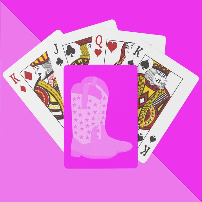Jeu De Cartes Bottes Cowboy avec étoiles sur Arrière - plan rose (A deck of playing cards with a pair of pink cowboy boots on a pink background.)