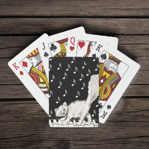 Jeu De Cartes Chat blanc duveteux souriant clignant sur un piano