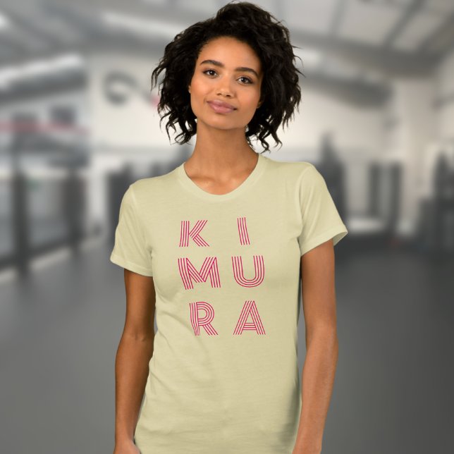 JJ Kimura Jiu Jitsu Cream T-Shirt (Kimura BJJ t-shirt in cream worn by a female model in the gym.)