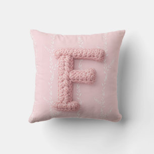 Joli coussin rond lettre F en crochet rose bohème