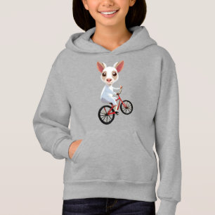 Jolie petite chèvre blanche sur une bicyclette