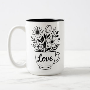 Jolie tasse à thé noire avec mug à fleurs