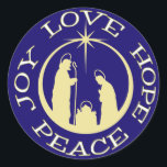 Joy Liebe Hope Peace Christmas Runder Aufkleber<br><div class="desc">Behalt Christus in deiner Weihnachtskorrespondenz und Aktivitäten mit diesem schönen Aufkleber "Joy Liebe Hope Peace". Der Text umkreist eine Krippe der goldenen Silhouette mit dem Stern von Bethlehem ganz oben. Alles ist auf einem dunkelblauen Hintergrund platziert,  um es wirklich zu heben.</div>