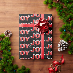 JOY-Text mit Schneeflocken auf schwarzem Hintergru Geschenkpapier