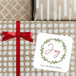 Joy Typography Script Christmas Wreath Holiday Quadratischer Aufkleber<br><div class="desc">Send out this year's holiday greetings in style with these unique and modern holiday stickers. The design features a festive typography script "Joy" inside a watercolor foliage wreath. These stickers can be used as envelope seals, Christmas gift tags, holiday party favor stickers, and much, much more! Easily add your custom...</div>