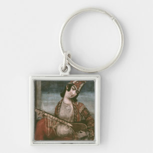 Junge Frau, die eine Gitarre spielt Schlüsselanhänger