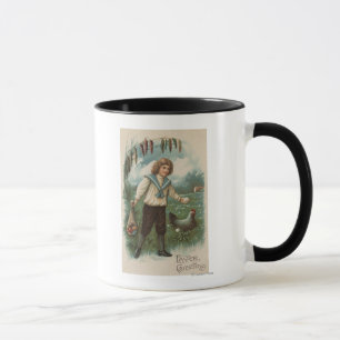 Junge mit dem Osterei-Korb, der Ei hält Tasse