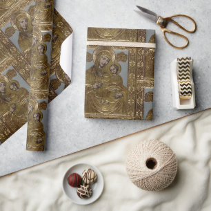Jungfrau Mary und goldenes elegantes Geschenkpapier