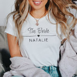 Junggeselinnen-Abschied Team Bride Personalisiert  T-Shirt<br><div class="desc">Mit unserem Team Bride Personalisiert Bridal T - Shirt - die perfekte Mischung aus Stil, Feiern und Personalisierung für Ihren unvergesslichen Junggeselinnen-Abschied! Tauchen Sie ein in die Freude, Teil der Brautkommando zu sein, mit diesen speziell gefertigten Shirts, die so einzigartig wie Ihre Bindung sind. Diese Junggeselinnen-Abschied-Shirts sind mit einem Herzmotiv...</div>