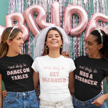 Junggeselinnen-Abschied wird höchstwahrscheinlich  T-Shirt<br><div class="desc">Bringen Sie eine Touch spielerischer Vorfreude auf die Bachelorette-Festlichkeiten mit diesem charmanten und individuell gestaltbaren T - Shirt-Design! Mit dem perfekt passenden Satz "am ehesten VERHEIRATET zu werden" in zarten rosa Schriftzeichen vor knusprigem, weißem Hintergrund, ist dieses Design sowohl süß als auch leicht. Es ist eine ideale Wahl für die...</div>