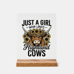 Juste une fille qui aime les vaches des Highlands 