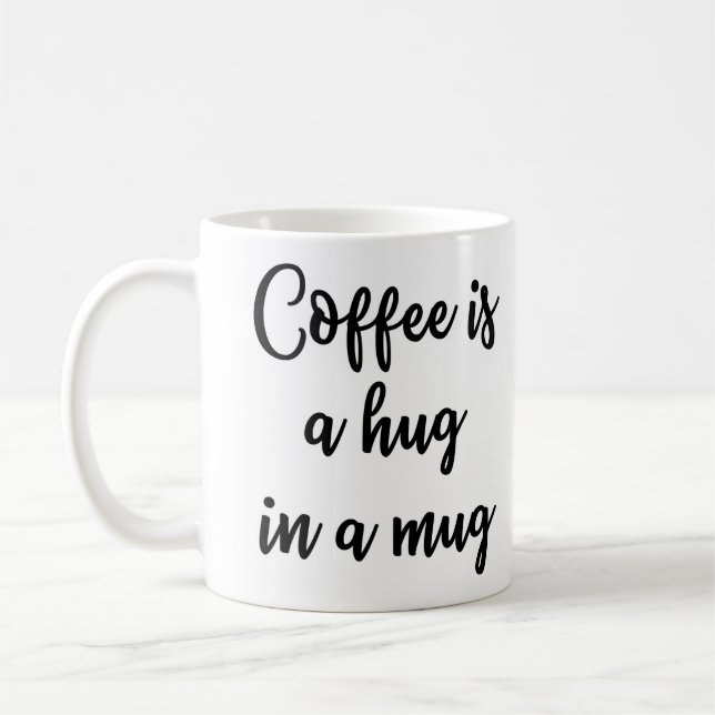 Kaffee ist eine Umarmung in einer Tasse Tasse (Links)