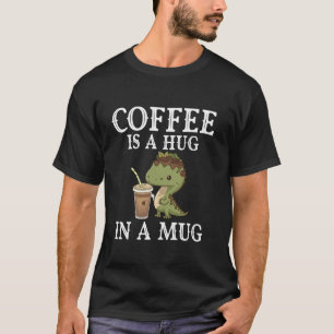 Kaffee ist in einer Tasse ein Schluck Dinosaurier- T-Shirt
