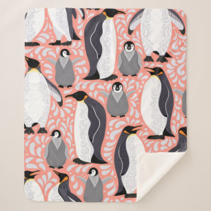 Kaiserpinguine und ihre Naben auf einem rosa Muste Sherpadecke