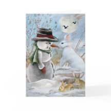 Kaninchen isst die Nasen-Karten des Schneemanns