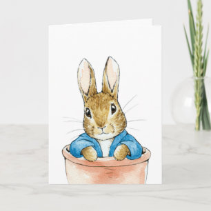 Kaninchen sitzt in einem Blumenkübel     Karte