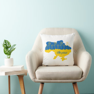 Karte der Ukraine mit Sonnenblumen und ukrainische Kissen