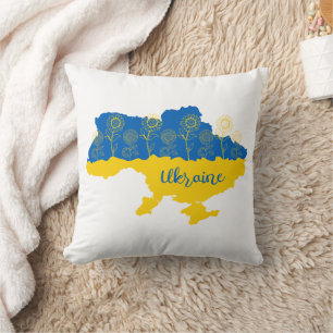 Karte der Ukraine mit Sonnenblumen und ukrainische Kissen
