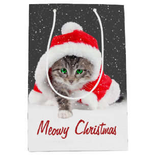 Kätzchen in Weihnachtsmannmütze und Schneeflocken Mittlere Geschenktüte