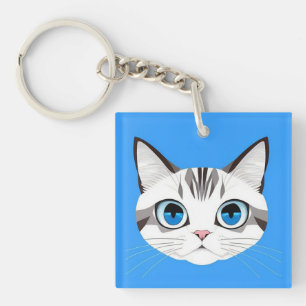 Katze mit blauen Augen vor einem hellblauen Hinter Schlüsselanhänger