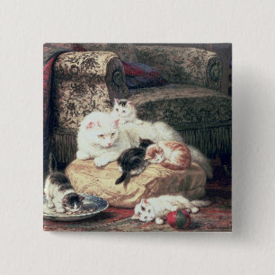 Katze mit ihren Kätzchen auf einem Kissen Button