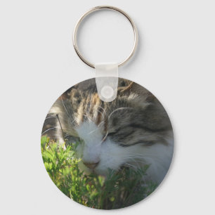 Katze riecht eine Pflanze Schlüsselanhänger