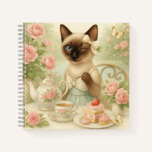 Katze trinkt Nachmittagstee im Garten Notizbuch
