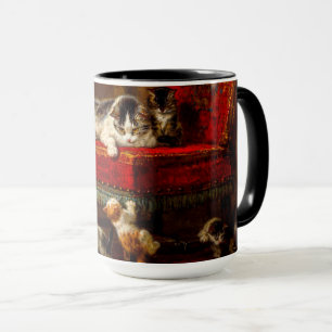 Katze und Kätzchen spielen mit Stuhl Tasse