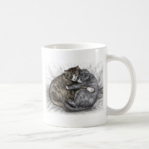 Katzen schlafen kaffeetasse