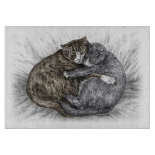 Katzen schlafen schneidebrett